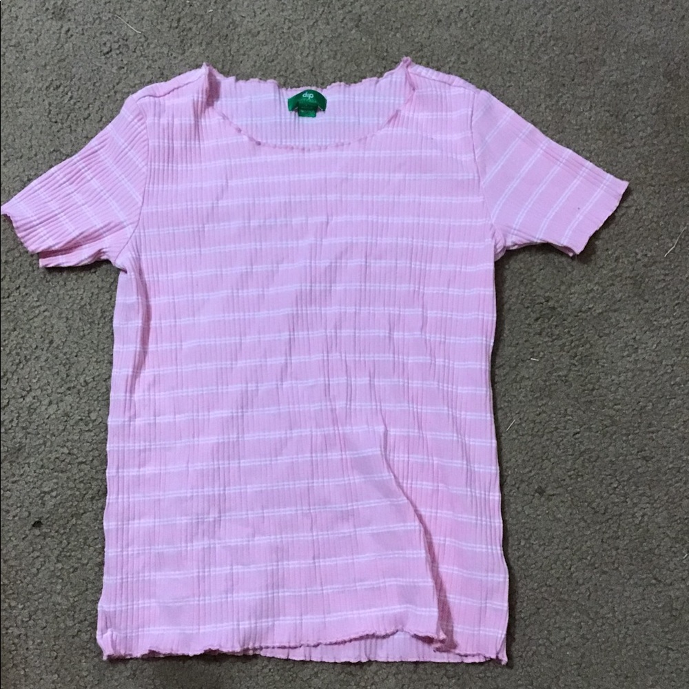 Pink and white shirt.